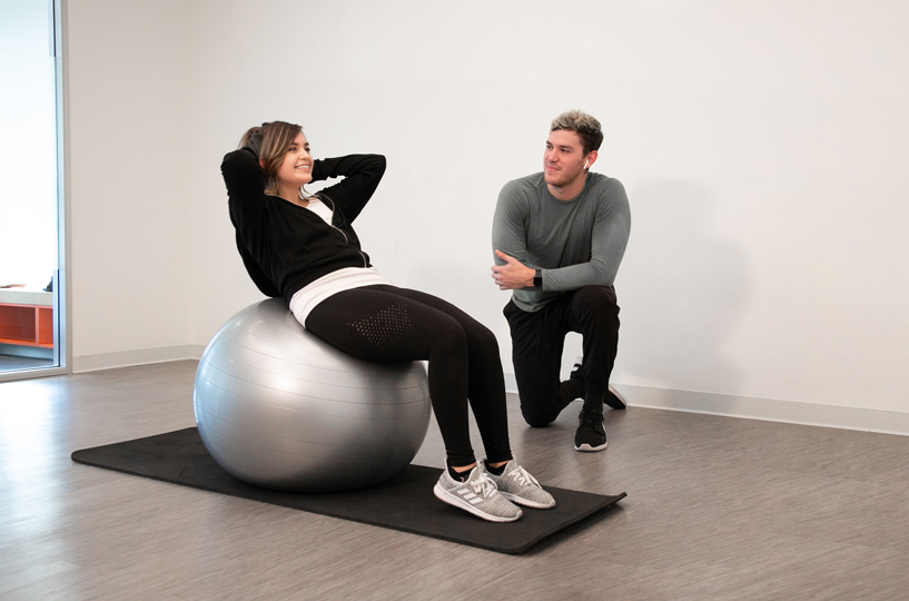 Personal trainer using positive communication methods to keep client accountable to her fitness goals.