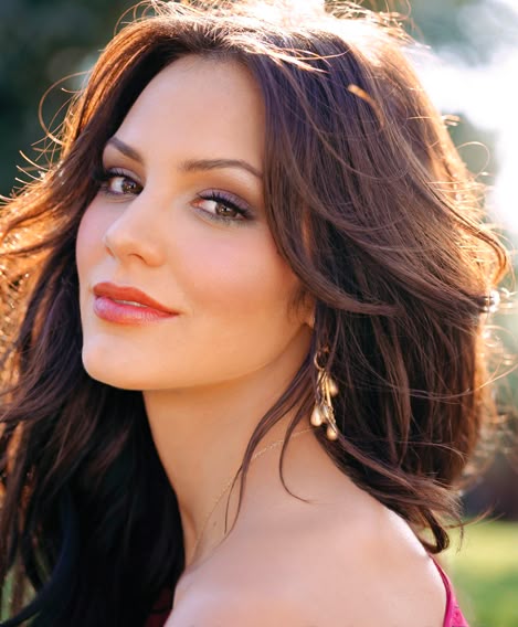 Chestnut brown, chocolate brown hair with long layers and waves with a middle part